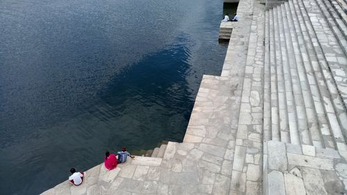 High angle view of people walking on footpath