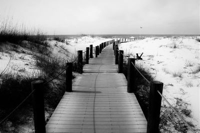 Pier on sea against sky