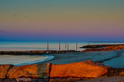 Scenic view of sea at sunset