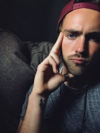 Portrait of young man holding camera