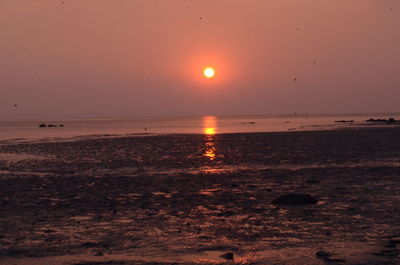 Scenic view of sea against sky at sunset