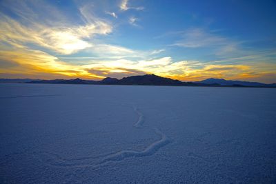 Scenic view of mountains against sky during sunset