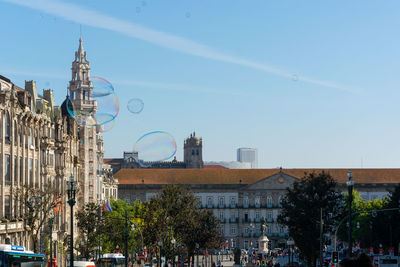 Buildings in city against sky