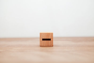 Close-up of dices on table against white background