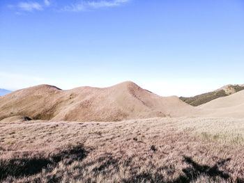 Scenic view of arid landscape against clear sky
