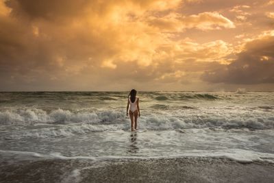 Scenic view of sea against cloudy sky