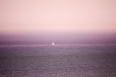 Scenic view of sea against clear sky during sunset