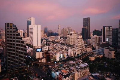Cityscape against cloudy sky