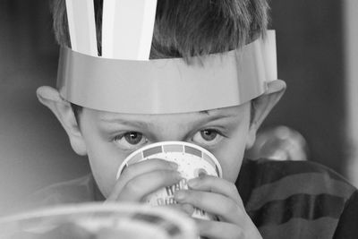 Close-up portrait of boy drinking water
