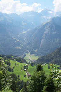 Scenic view of landscape and mountains against sky