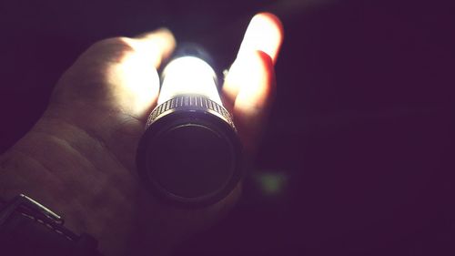 Close-up of human hand against blurred background