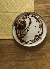 High angle view of chocolate cake in plate on table
