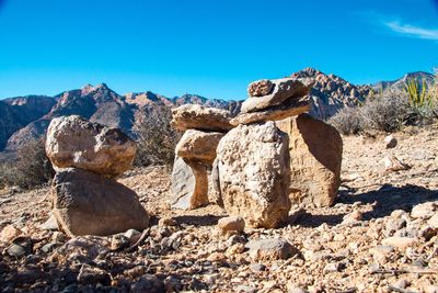 Rock formation against clear blue sky