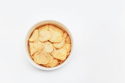 High angle view of bread in bowl against white background