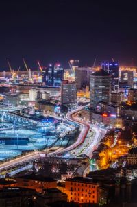 High angle view of illuminated buildings in city at night