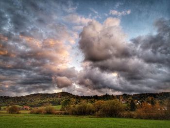 Scenic view of landscape against cloudy sky