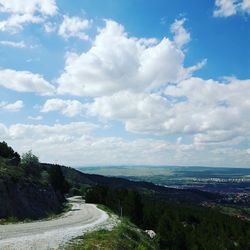 Scenic view of landscape against cloudy sky