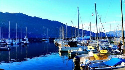 Boats moored at harbor