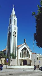 Low angle view of church against clear blue sky