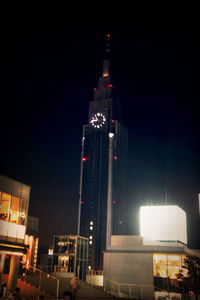 Low angle view of modern building at night