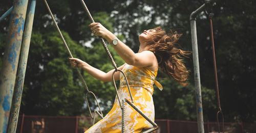 Side view of young woman playing 