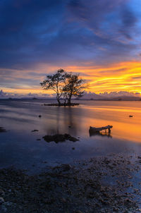 Scenic view of lake against sky during sunset