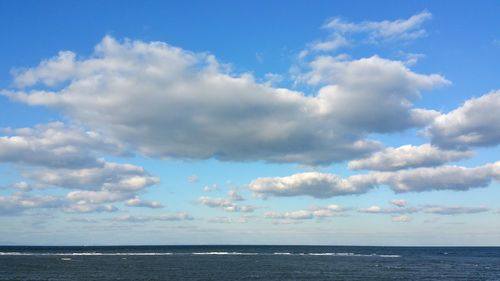 Scenic view of sea against blue sky