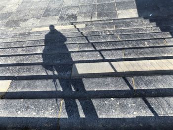 High angle view of man walking on staircase
