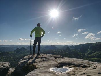 Sport athlete runner man in mountain trail. fitness man runner running on sunrise mountain top edge