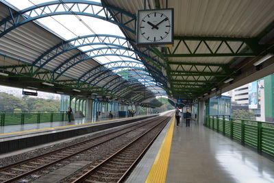 Clock hanging at railroad station