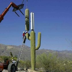 Low angle view of machine against clear blue sky