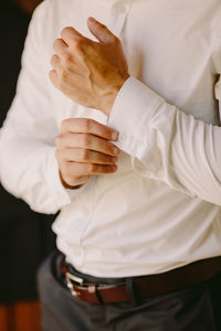 Midsection of man holding ice cream