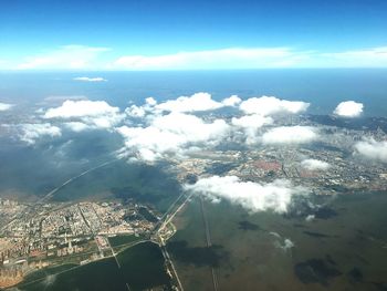 Aerial view of sea and landscape against sky