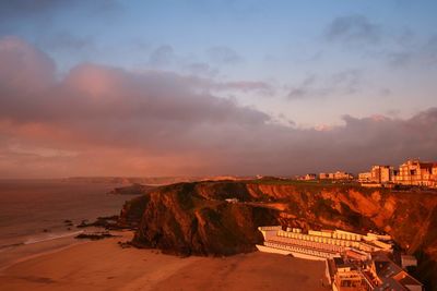 Panoramic view of beach against cloudy sky