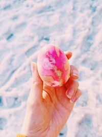 Close-up of hand holding ice cream