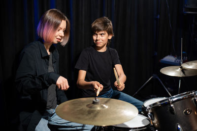 Portrait of man playing drum