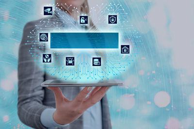 Digital composite image of hand holding smart phone
