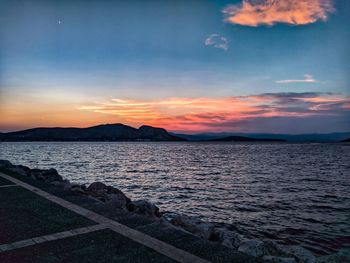 Scenic view of sea against sky at sunset