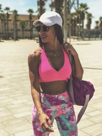 Young woman wearing sunglasses standing outdoors