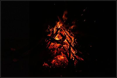 View of bonfire at night