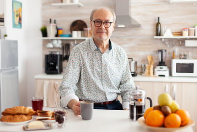 Man having breakfast at home