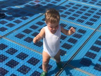 High angle portrait of boy in swimming pool