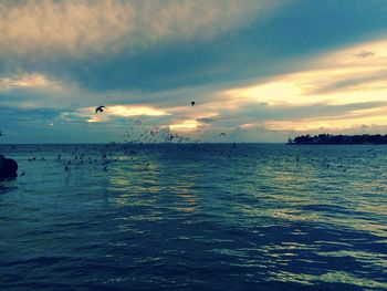 Scenic view of sea against cloudy sky