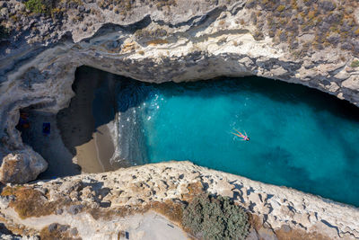 High angle view of rocks in sea