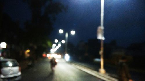 Illuminated street lights at night