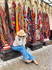 Low section of woman standing on street