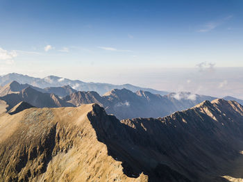 Panoramic view of snowcapped mountains against sky