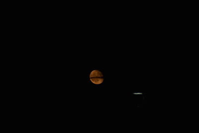 Scenic view of moon against clear sky at night