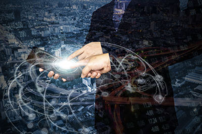 Double exposure image of businessmen with digital table and cityscape