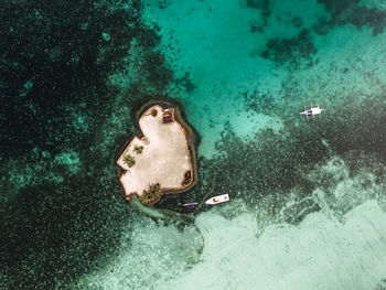 High angle view of man swimming in sea